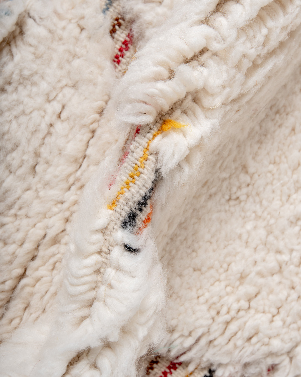 Modern, designer, handcrafted Berber rug from Morocco. Beniourain carpet with beautiful colours and patterns and fluffy wool texture.